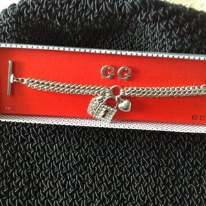 Guess charm bracelet and earring set